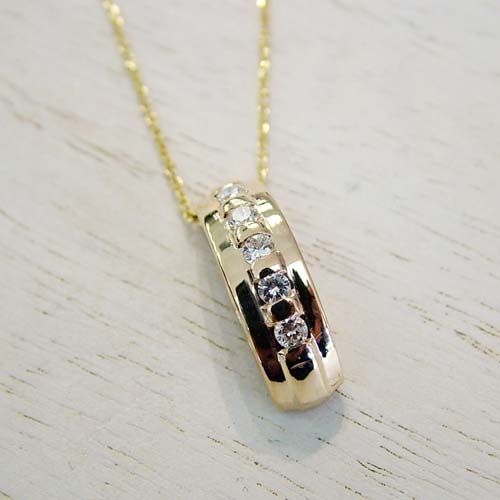 Repurposed wedding ring into modern pendant