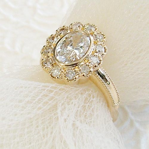 Halo diamond engagement ring in yellow gold, one of the most popular engagement ring styles for 2026.
